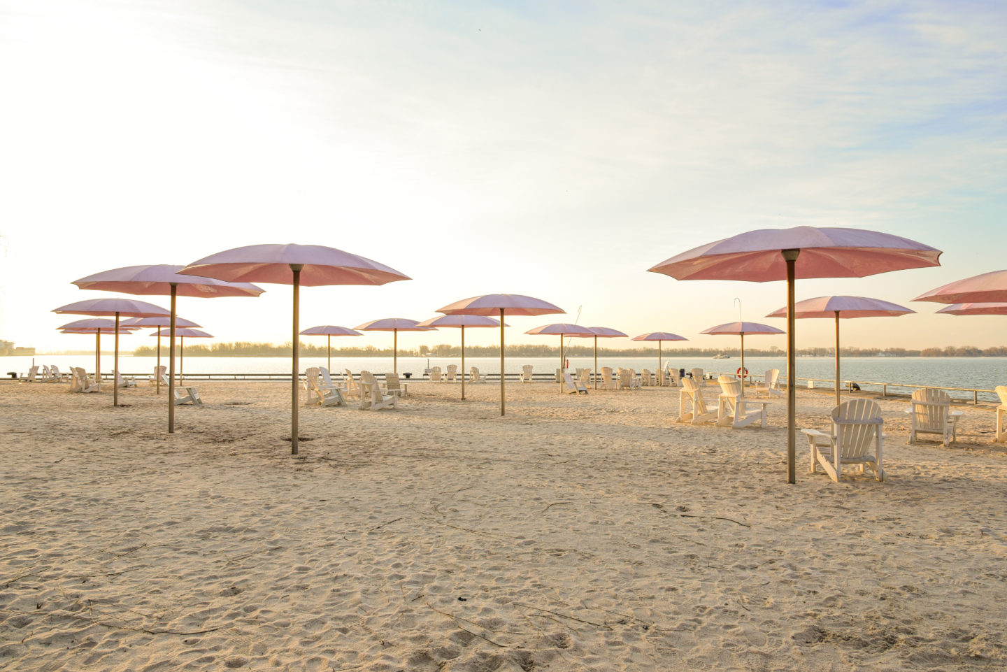 White Sand Beach with Pink Umbrellas